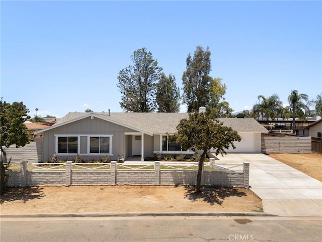 11187 58th St, Jurupa Valley, CA 91752 - view of front of property featuring driveway, a garage, and a shingled roof