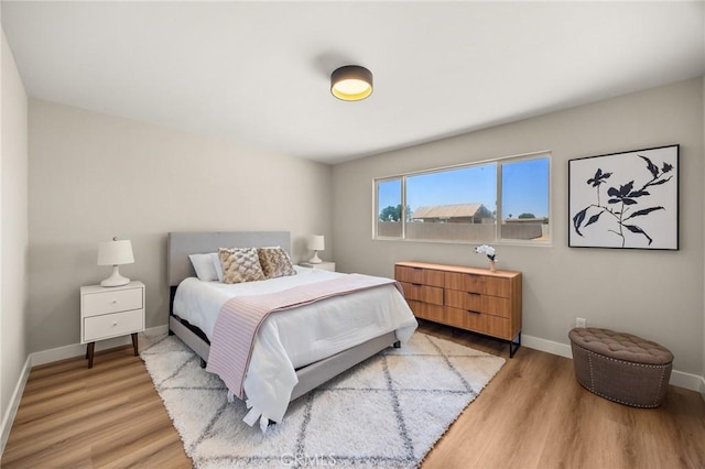 11187 58th St, Jurupa Valley, CA 91752 - bedroom featuring baseboards and light wood-type flooring