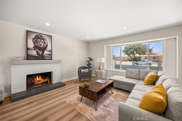 11187 58th St, Jurupa Valley, CA 91752 - living room featuring a fireplace, wood finished floors, and recessed lighting