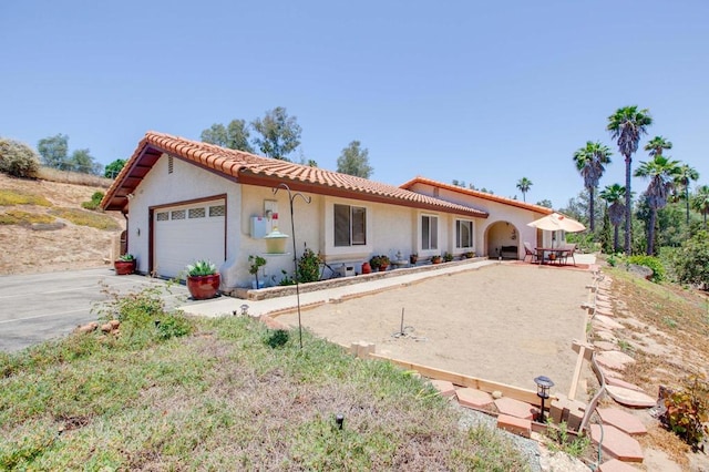 2605 Kauana Loa Dr, Escondido, CA 92029 - view of front of property with a garage, driveway, a tiled roof, and stucco siding