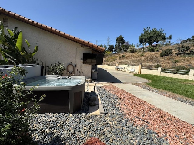 2605 Kauana Loa Dr, Escondido, CA 92029 - view of side of property featuring stucco siding, a patio area, a tile roof, and a hot tub