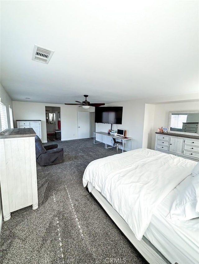 12920 La Costa Ct, Hesperia, CA 92344 - bedroom with dark colored carpet and ceiling fan