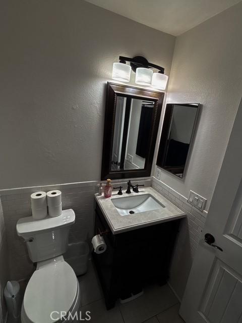 12920 La Costa Ct, Hesperia, CA 92344 - half bath featuring vanity and tile patterned flooring