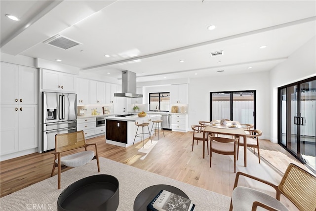 214 W Mariposa Unit B, San Clemente, CA 92672 - living room featuring healthy amount of natural light, light wood finished floors, and recessed lighting