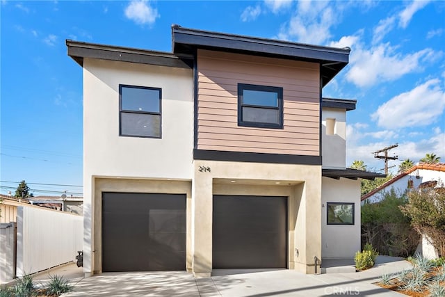 214 W Mariposa Unit B, San Clemente, CA 92672 - contemporary home featuring stucco siding, a garage, and concrete driveway