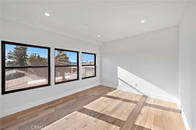 214 W Mariposa Unit B, San Clemente, CA 92672 - spare room featuring wood finished floors and recessed lighting