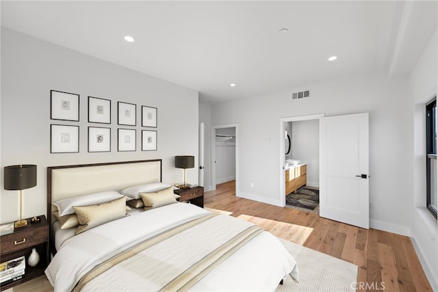 214 W Mariposa Unit B, San Clemente, CA 92672 - bedroom featuring light wood finished floors, recessed lighting, a walk in closet, and ensuite bathroom