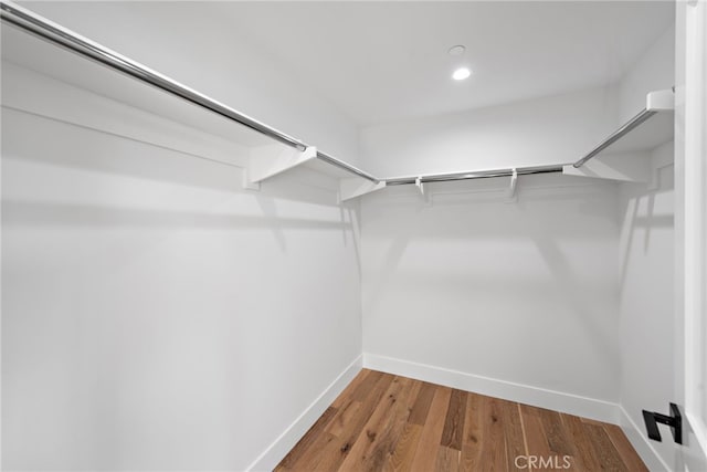 214 W Mariposa Unit B, San Clemente, CA 92672 - walk in closet with wood finished floors