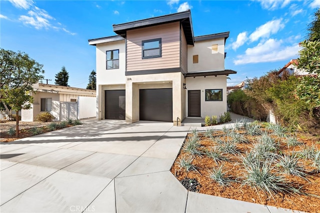 214 W Mariposa Unit B, San Clemente, CA 92672 - contemporary house with stucco siding, concrete driveway, and an attached garage