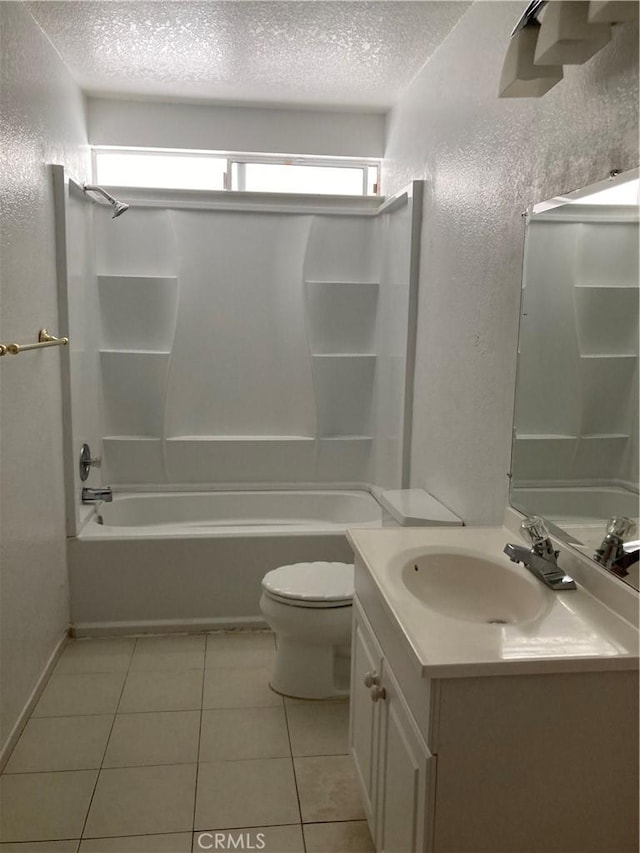 16840 Mackennas Gold Ave, Lake Los Angeles, CA 93591 - full bathroom featuring a textured ceiling, vanity, bathing tub / shower combination, tile patterned floors, and a textured wall