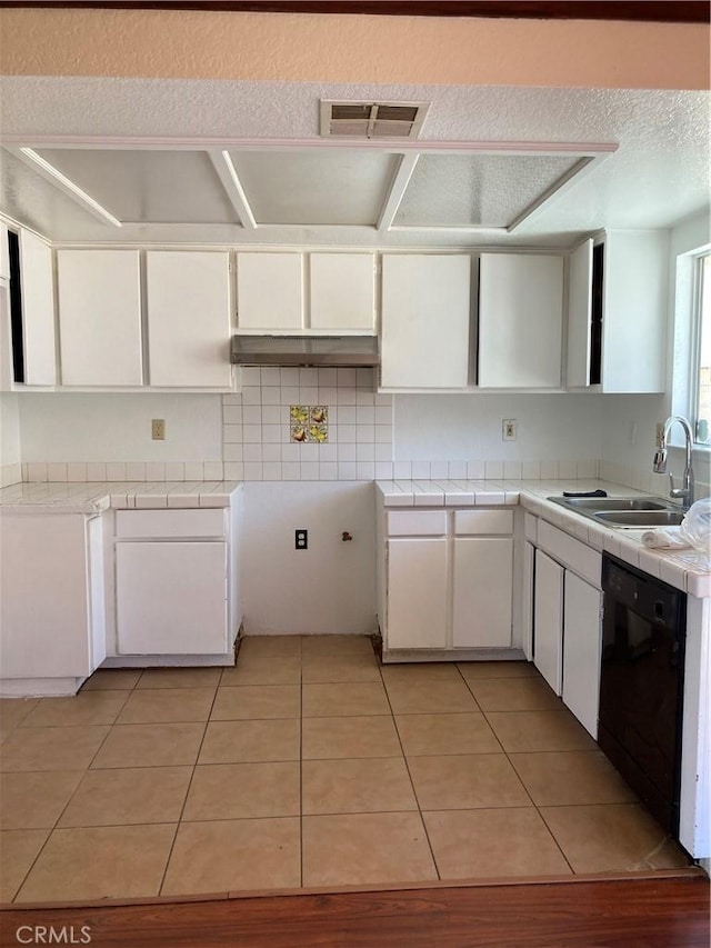 16840 Mackennas Gold Ave, Lake Los Angeles, CA 93591 - kitchen with dishwasher, tile countertops, white cabinets, decorative backsplash, and a textured ceiling