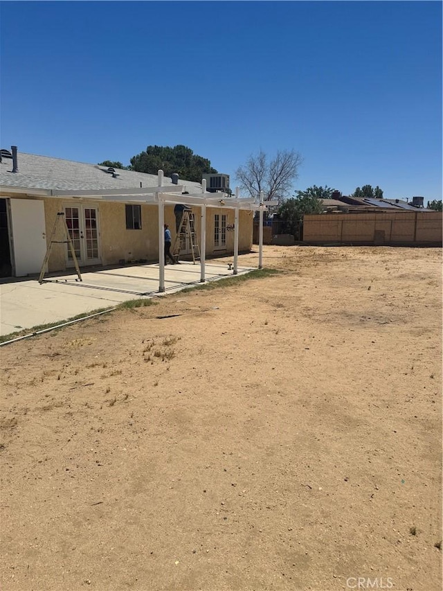 16840 Mackennas Gold Ave, Lake Los Angeles, CA 93591 - view of yard with french doors and a patio