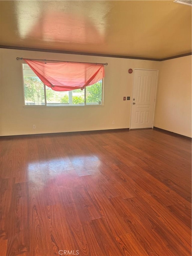 16840 Mackennas Gold Ave, Lake Los Angeles, CA 93591 - spare room featuring wood finished floors and crown molding