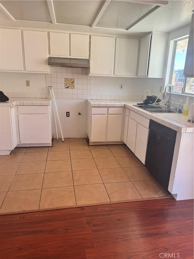 16840 Mackennas Gold Ave, Lake Los Angeles, CA 93591 - kitchen with dishwasher, tile countertops, light tile patterned floors, and white cabinets