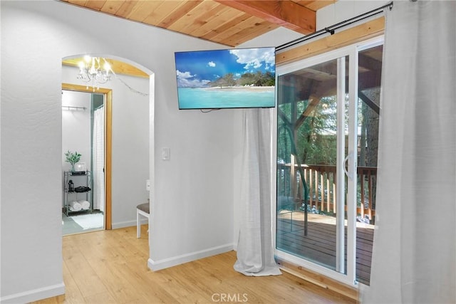 28410 Altamont Ct, Lake Arrowhead, CA 92352 - interior space with wood ceiling, arched walkways, wood finished floors, and a chandelier