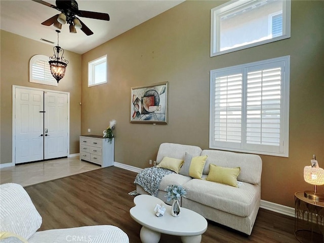 4717 Torrey Pines Dr, Chino Hills, CA 91709 - living room with wood finished floors, a ceiling fan, and a high ceiling