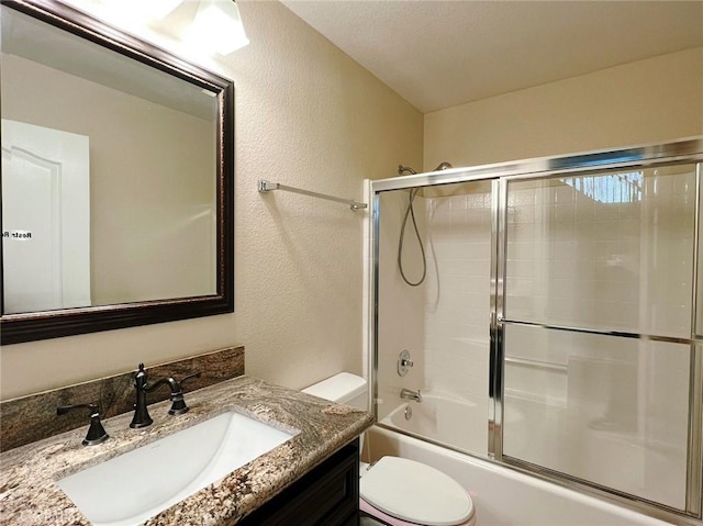 4717 Torrey Pines Dr, Chino Hills, CA 91709 - bathroom featuring vanity, combined bath / shower with glass door, and a textured wall