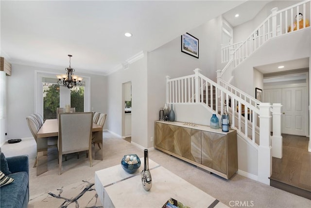 3 Heatherwood, Irvine, CA 92620 - living area with stairs, a chandelier, recessed lighting, ornamental molding, and light carpet