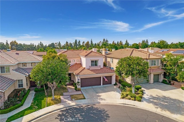 3 Heatherwood, Irvine, CA 92620 - view of front facade featuring a residential view, concrete driveway, a tiled roof, and stucco siding