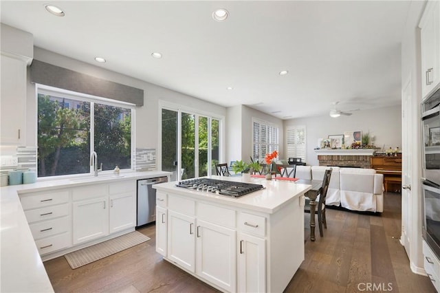 3 Heatherwood, Irvine, CA 92620 - kitchen with stainless steel appliances, a ceiling fan, recessed lighting, open floor plan, and wood finished floors