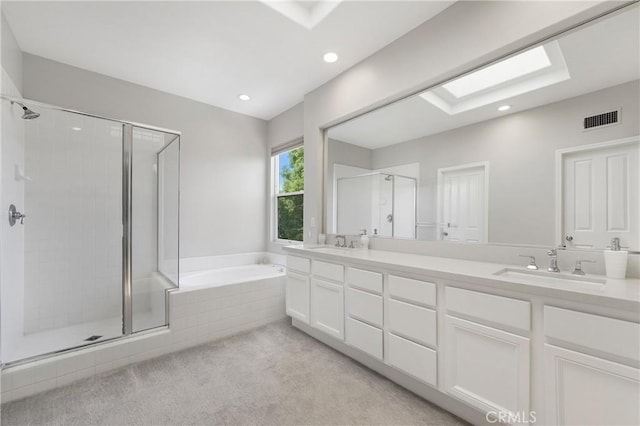 3 Heatherwood, Irvine, CA 92620 - bathroom featuring a shower stall, double vanity, a garden tub, and recessed lighting
