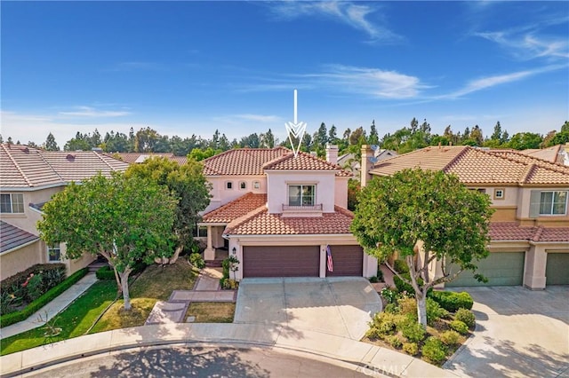 3 Heatherwood, Irvine, CA 92620 - view of front facade with a tile roof, concrete driveway, an attached garage, stucco siding, and a residential view