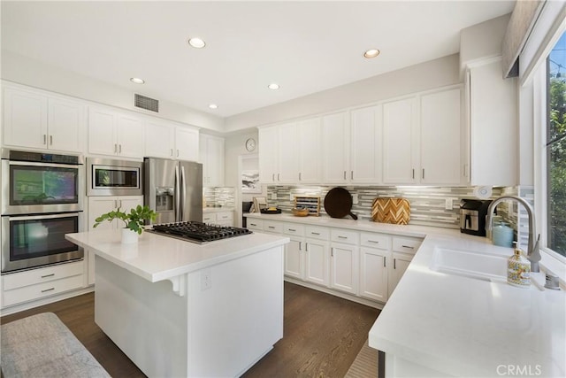 3 Heatherwood, Irvine, CA 92620 - kitchen featuring stainless steel appliances, a center island, light countertops, and recessed lighting