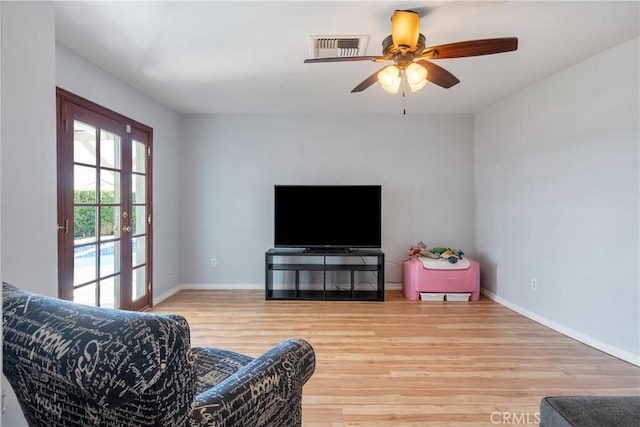 469 N Nearglen Ave, Covina, CA 91724 - living area with wood finished floors and a ceiling fan