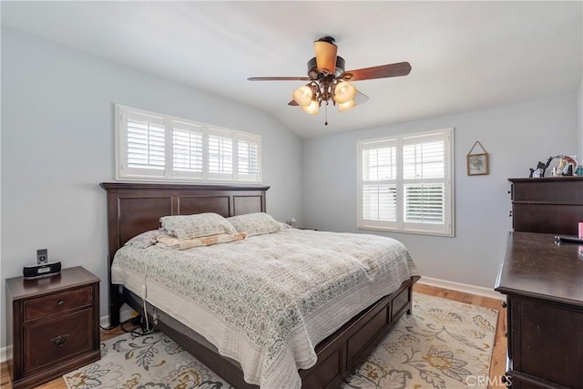 469 N Nearglen Ave, Covina, CA 91724 - bedroom with multiple windows, light wood-style flooring, vaulted ceiling, and a ceiling fan