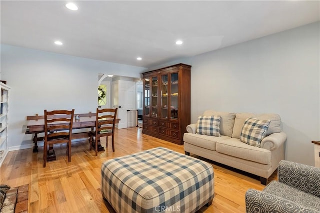 469 N Nearglen Ave, Covina, CA 91724 - living room with light wood-type flooring, recessed lighting, and radiator