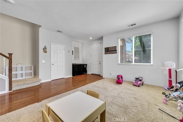 24934 Pine Creek Loop, Corona, CA 92883 - living area with wood finished floors, recessed lighting, stairway, and carpet