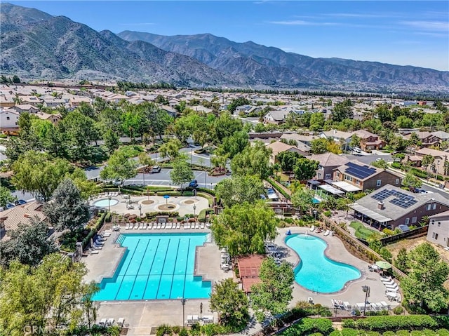24934 Pine Creek Loop, Corona, CA 92883 - aerial view of residential area featuring a pool and a mountain backdrop