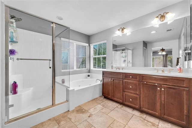 24934 Pine Creek Loop, Corona, CA 92883 - full bath with a shower stall, double vanity, a tub with jets, stone tile flooring, and ceiling fan