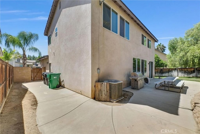 24934 Pine Creek Loop, Corona, CA 92883 - view of side of home featuring a patio area, a fenced backyard, and stucco siding