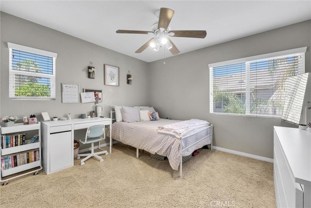 24934 Pine Creek Loop, Corona, CA 92883 - bedroom with multiple windows, light colored carpet, and ceiling fan
