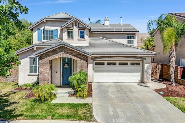 24934 Pine Creek Loop, Corona, CA 92883 - traditional-style house featuring driveway, stucco siding, and a tile roof