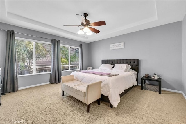 24934 Pine Creek Loop, Corona, CA 92883 - carpeted bedroom with a tray ceiling and a ceiling fan