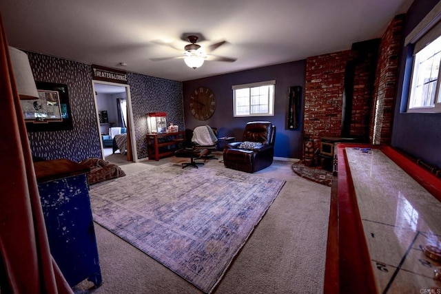 16320 Dartolo Rd, Ramona, CA 92065 - living room featuring carpet flooring, plenty of natural light, a ceiling fan, a wood stove, and wallpapered walls