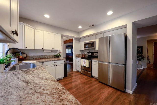 16320 Dartolo Rd, Ramona, CA 92065 - kitchen featuring appliances with stainless steel finishes, white cabinets, dark wood finished floors, and recessed lighting