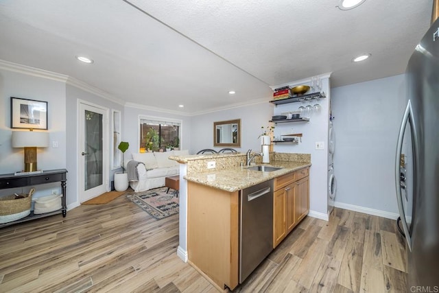 3773 1st Ave Unit 2, San Diego, CA 92103 - kitchen with stainless steel appliances, stacked washer and clothes dryer, light wood-type flooring, ornamental molding, and open shelves