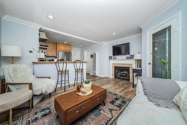 3773 1st Ave Unit 2, San Diego, CA 92103 - living area with ornamental molding, wood finished floors, recessed lighting, a fireplace, and a heating unit