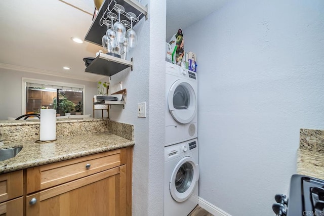 3773 1st Ave Unit 2, San Diego, CA 92103 - laundry room with stacked washing machine and dryer and ornamental molding