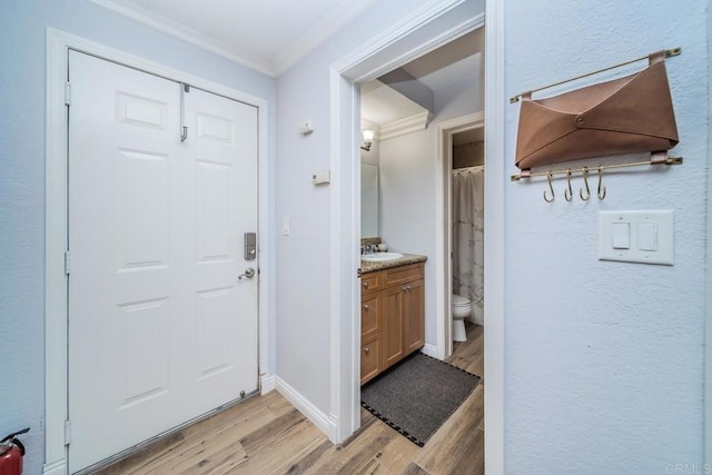 3773 1st Ave Unit 2, San Diego, CA 92103 - entrance foyer with light wood finished floors and crown molding