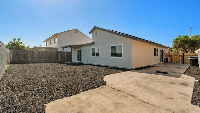 6117 Parkside Ave, San Diego, CA 92139 - back of house with a patio, a fenced backyard, and stucco siding