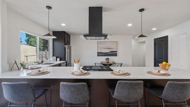 6117 Parkside Ave, San Diego, CA 92139 - kitchen with island range hood, light countertops, freestanding refrigerator, pendant lighting, and recessed lighting