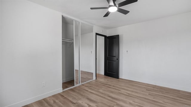 6117 Parkside Ave, San Diego, CA 92139 - unfurnished bedroom with a closet, wood finished floors, and a ceiling fan