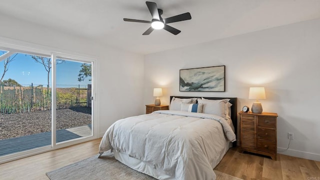 6117 Parkside Ave, San Diego, CA 92139 - bedroom featuring access to exterior, wood finished floors, and a ceiling fan