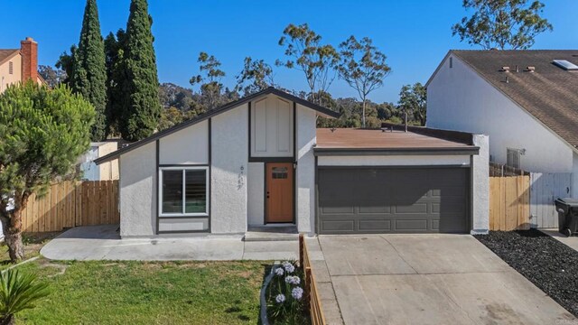 6117 Parkside Ave, San Diego, CA 92139 - view of front of house with an attached garage, driveway, and stucco siding