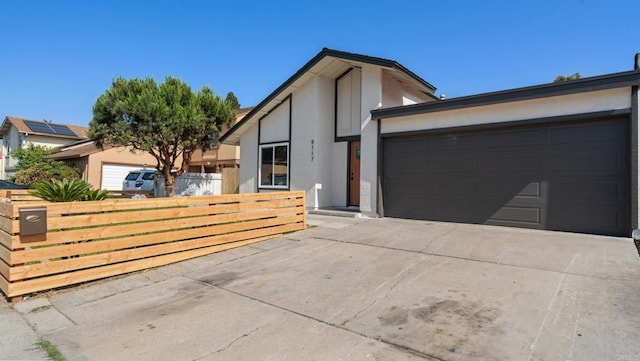 6117 Parkside Ave, San Diego, CA 92139 - view of front of home featuring driveway, an attached garage, and stucco siding