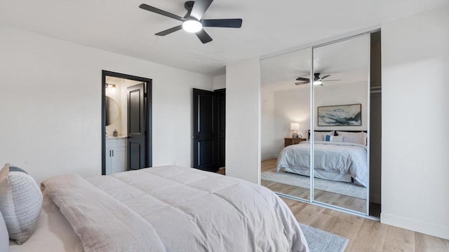 6117 Parkside Ave, San Diego, CA 92139 - bedroom with light wood finished floors, a ceiling fan, a closet, and connected bathroom